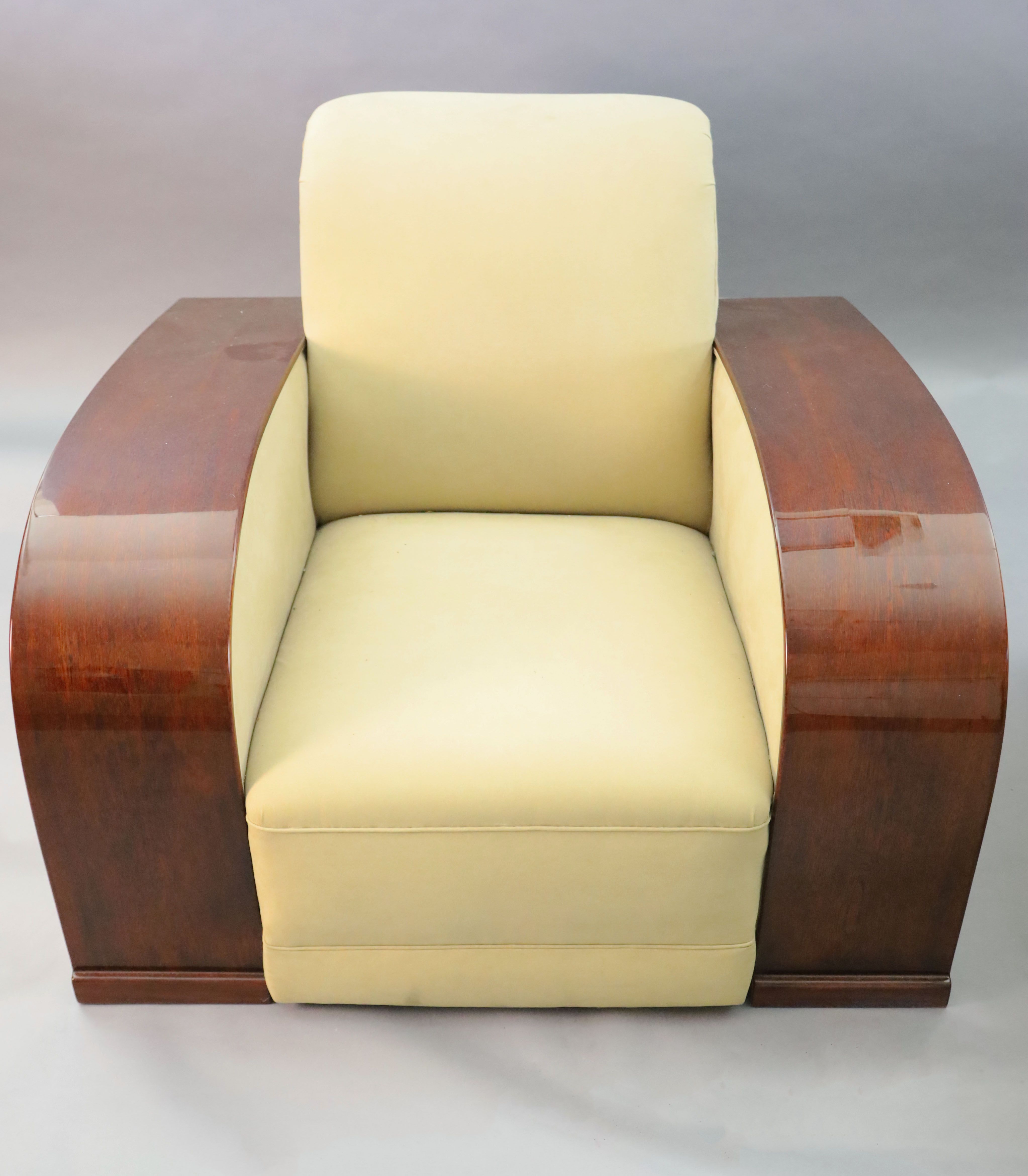 An Art Deco style mahogany and suede three piece suite, settee W.6ft 6in. D.3ft 4in. H.2ft 6in.